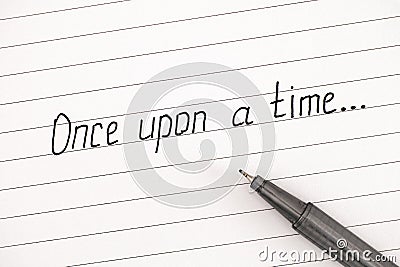 Handwriting text Once Upon a Time on lined paper with pen Stock Photo