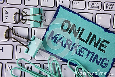 Handwriting text Online Marketing. Concept meaning Marketing digital advertising social media e-commerce written on Sticky Note pa Stock Photo