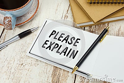 Handwriting text PLEASE EXPLAIN on the notepad Stock Photo