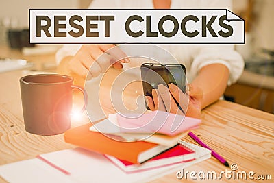 Handwriting text Reset Clocks. Concept meaning To revisit return to or recreate a time or era from the past woman using Stock Photo