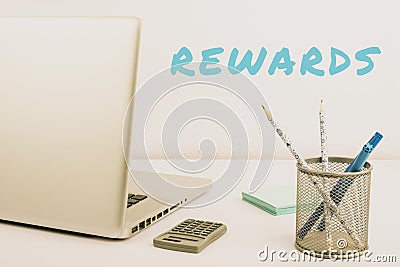 Handwriting text Rewards. Word Written on certain number or percentage you earn for every dollar you charge Stock Photo