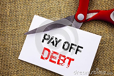 Handwriting text showing Pay Off Debt. Conceptual photo Reminder To Paying Owed Financial Credit Loan Bills written on Sticky Note Stock Photo