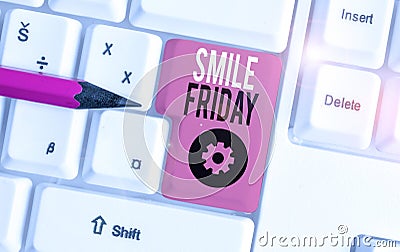 Handwriting text Smile Friday. Concept meaning used to express happiness from beginning of fresh week White pc keyboard Stock Photo