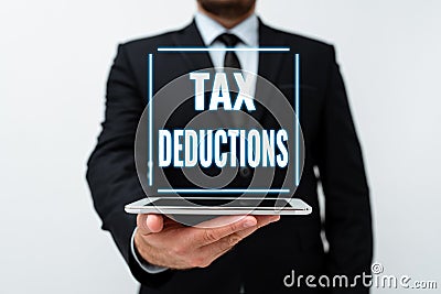 Handwriting text Tax Deductions. Business idea reduction income that is able to be taxed of expenses Presenting New Stock Photo