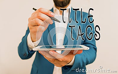 Handwriting text Title Tags. Concept meaning the HTML element that specifies the title of a web page Businessman Stock Photo