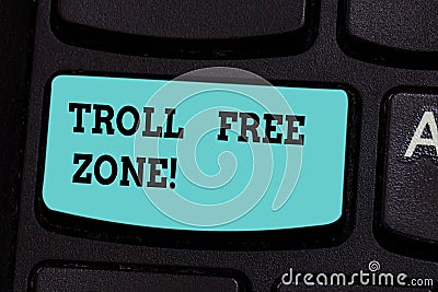 Handwriting text Troll Free Zone. Concept meaning Social network where tolerance and good behavior is a policy Keyboard Stock Photo