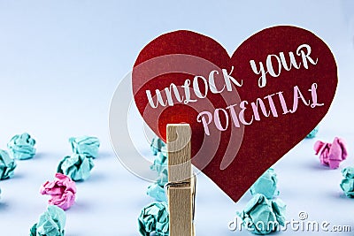 Handwriting text Unlock Your Potential. Concept meaning Reveal talent Develop abilities Show personal skills written on Red Paper Stock Photo