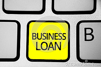 Handwriting text writing Business Loan. Concept meaning Credit Mortgage Financial Assistance Cash Advances Debt Keyboard yellow ke Stock Photo