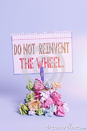 Handwriting text writing Do Not Reinvent The Wheel. Concept meaning stop duplicating a basic method previously done Reminder pile Stock Photo