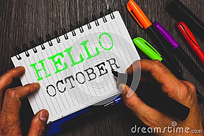 Handwriting text writing Hello October. Concept meaning Last Quarter Tenth Month 30days Season Greeting Man holding Stock Photo