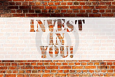Handwriting text writing Invest In You. Concept meaning Take care of yourself buy things for you Motivation Inspire Stock Photo