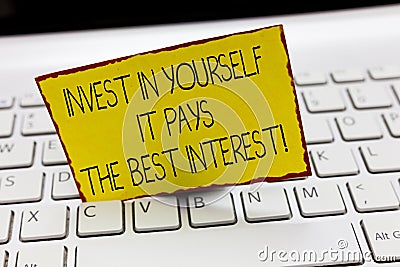 Handwriting text writing Invest In Yourself It Pays The Best Interest. Concept meaning Nurture oneself Plan the future Stock Photo