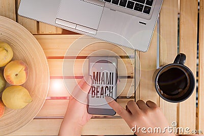 Handwriting text writing Miami Beach. Concept meaning the coastal resort city in MiamiDade County of Florida woman Stock Photo