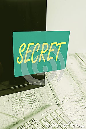 Handwriting text writing Secret. Concept meaning something that is kept or meant to be kept unknown to others Notation paper taped Stock Photo