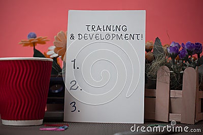 Handwriting text writing Training And Development. Concept meaning Organize Additional Learning expedite Skills Flowers Stock Photo