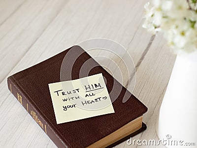 Trust GOD Jesus Christ LORD have faith and hope with all your heart. Closed Bible. Stock Photo