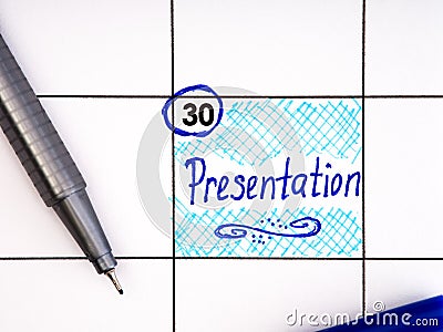 Handwritten reminder Presentation in the calendar with a blue pen Stock Photo