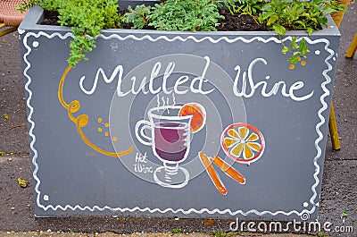 Handwritten sign mulled and simple drawing of a mulled wine glass with orange and cinnamon. Original ad attracting Editorial Stock Photo