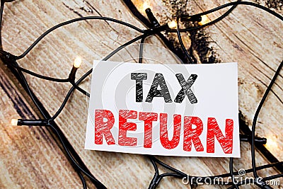 Handwritten text caption showing Tax Return. Business concept writing for Accounting Money Return written on sticky note paper on Stock Photo