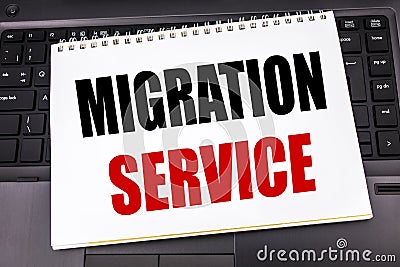 Handwritten text showing Migration Service. Business concept writing for Online Network Idea written on notepad note paper on the Stock Photo