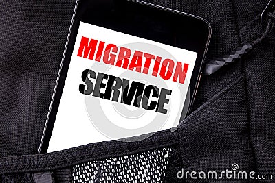 Handwritten text showing Migration Service. Business concept writing for Online Network Idea Written phone mobile phone, cellphone Stock Photo