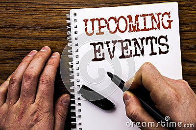 Handwritten text showing word Upcoming Events. Business concept for Appointment Agenda List Written on tablet laptop, wooden backg Stock Photo