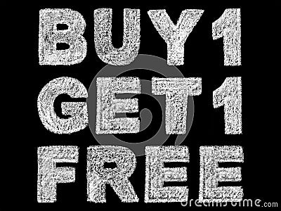 Handwritten white bold chalk lettering buy 1 get 1 free text on black background Stock Photo