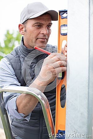 Handy man checking site outdoors Stock Photo