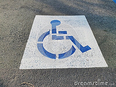 Handycap sign on Asphalt parking lot parking space Stock Photo