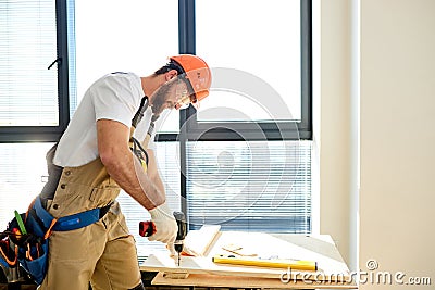 Handyman repairman screwing wood using drill, Diy at Home concept Stock Photo