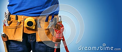 handyman tool belt on blue background with copy space Stock Photo