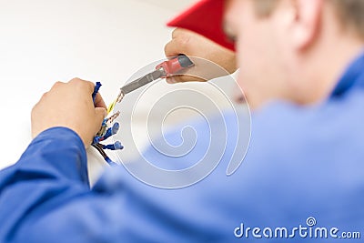 Handyman working with wires Stock Photo