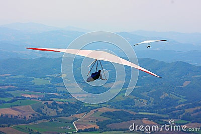 Hang glider pilot in Italian mountains Stock Photo