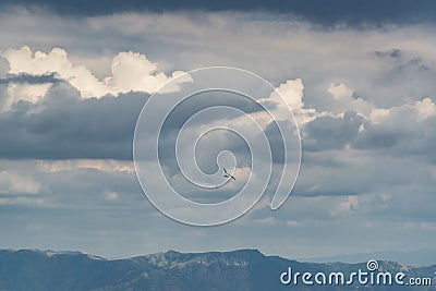 Hang glider wing in dramatic sky Stock Photo