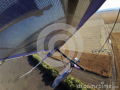 Hang glider wing over wheat field Stock Photo