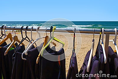 Hanged Wetsuits Stock Photo