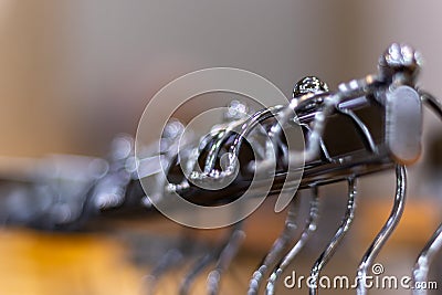 Hangers at a clothing store. Close up of Clothes rack with bokeh background Stock Photo