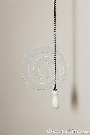 Old pull handle hanging bronze chain Stock Photo