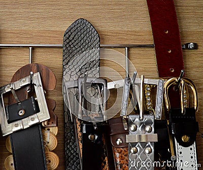 Hanging different colors belts, close-up. Stock Photo