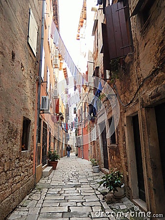 HANGING LAUNDRY IN A NARROW COBBLESTONE STREET, ROVINJ, CROATIA Editorial Stock Photo