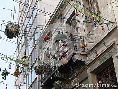 Hanging street lights across a street in Athens, Greece Stock Photo