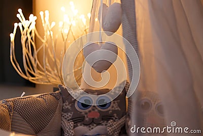 Hanging toys in a baby cot in the shape of a heart Stock Photo
