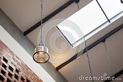 Hanging vintage ceiling yellow lamp interior at day light Stock Photo