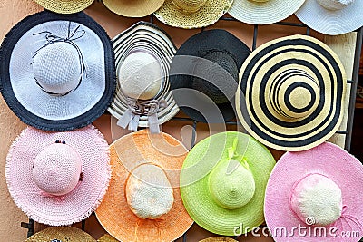 Hanging on the wall of colorful straw hats Stock Photo