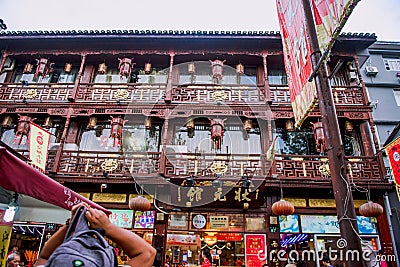 Hangzhou, China - August1, 2017: Street for tourists, traditional street food and soÐ³veniers, old historical architexture and Editorial Stock Photo