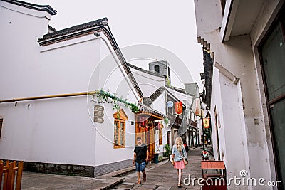 Hangzhou, China - August1, 2017: Street for tourists, traditional street food and soÐ³veniers, old historical architexture and Editorial Stock Photo