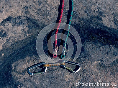 Hank sling carabiners at used red and green ropes Stock Photo