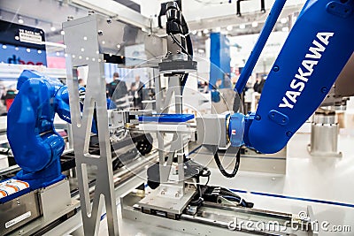 Yaskawa moto mini robot arm on Messe fair in Hannover, Germany Editorial Stock Photo