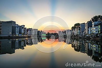 Hanoi cityscape at sunset. Resident buildings by Tien Bien lake, Gia Lam district Stock Photo