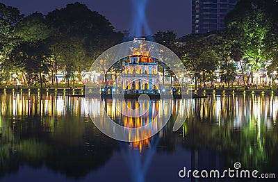 An ancient Turtle tower in the spotlight on Hoan Kiem Lake at night. Hanoi, Vietnam Editorial Stock Photo
